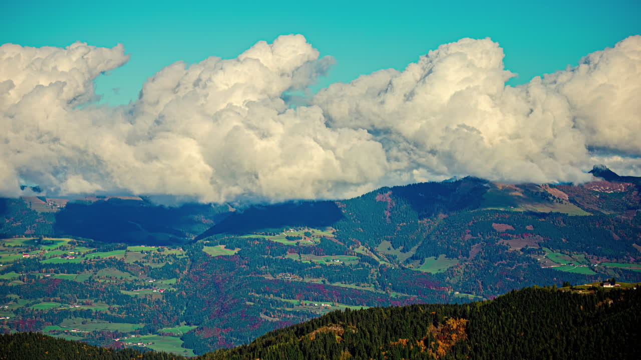 Billowing cloudscape time lapse over Austria's countryside in autumn