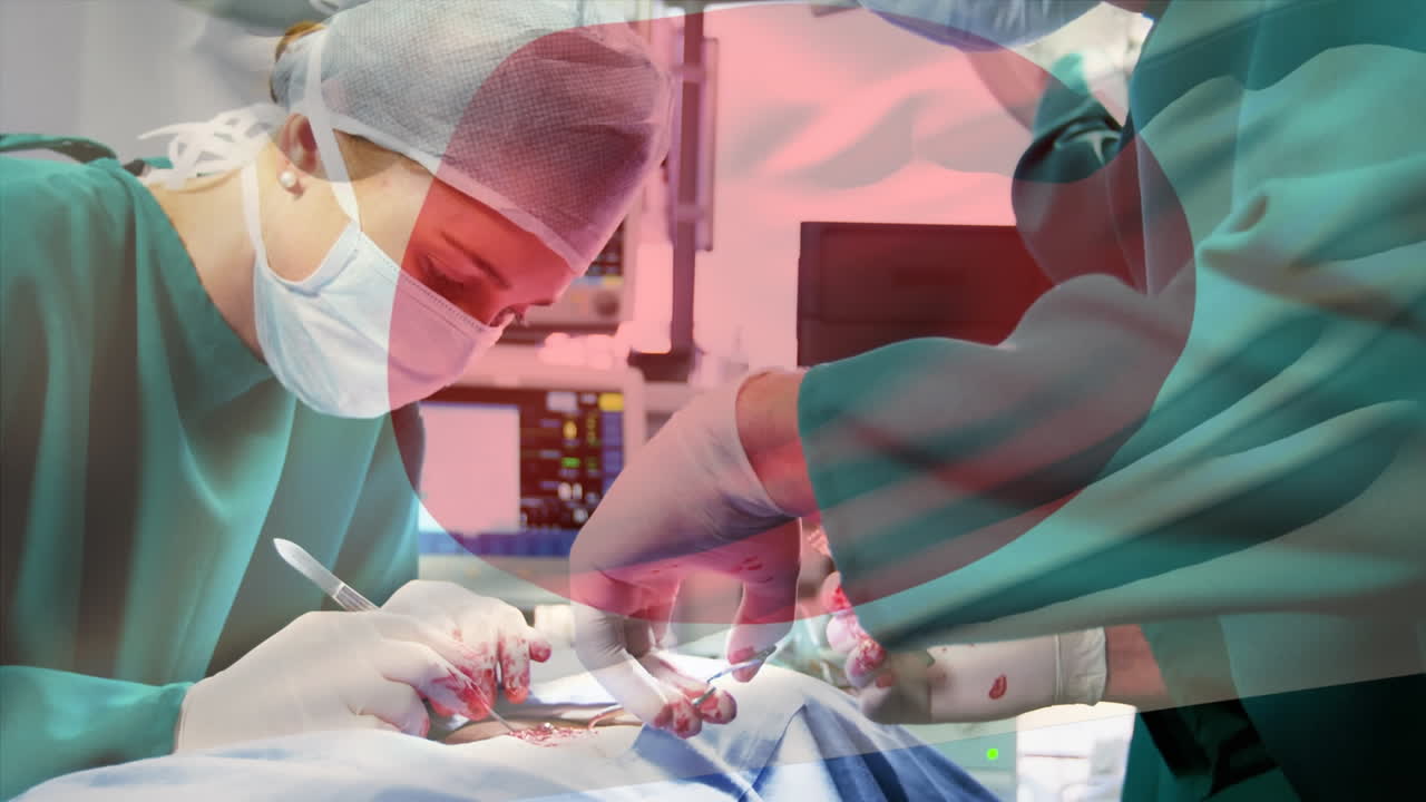 수술실 에서 외과 의사 들 위 에 흔들리는 일본 국기 의 애니메이션