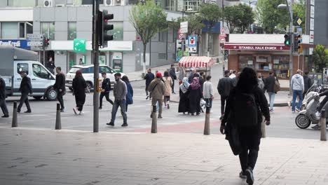 busy city street with pedestrians crossing