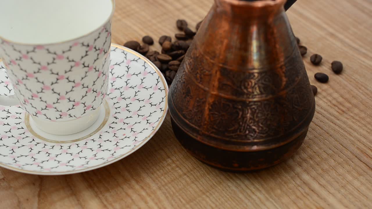 Rotation shot of Coffee, coffee cup and grains. Shooting in the movement