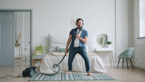 man dancing while vacuuming