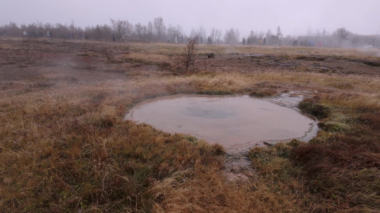 Hot, steaming water at the Strokkur, Iceland geothermal volcanic area in autumn