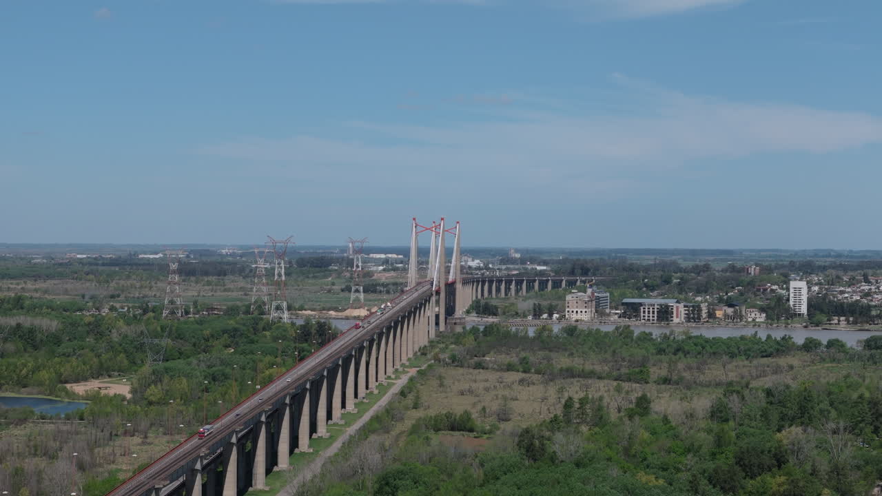 Aerial view of the historic Zárate-Brazo Largo suspension bridge. Entre Ríos Province. Argentina. 4k.