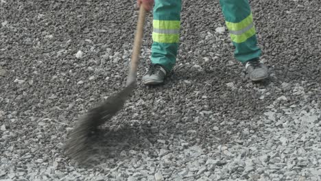 worker with shovel at construction works