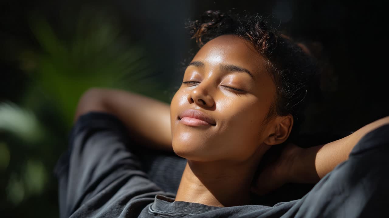 Relaxation and Serenity: A Woman Enjoys a Peaceful Moment Bathed in Natural Light, Embracing Calmness and Inner Peace in a Tranquil Environment