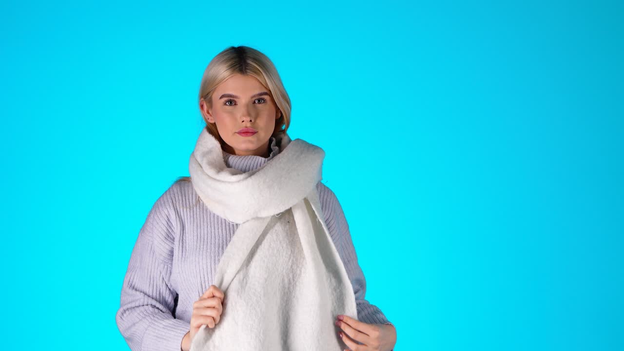 Woman in a White Scarf and Grey Sweater