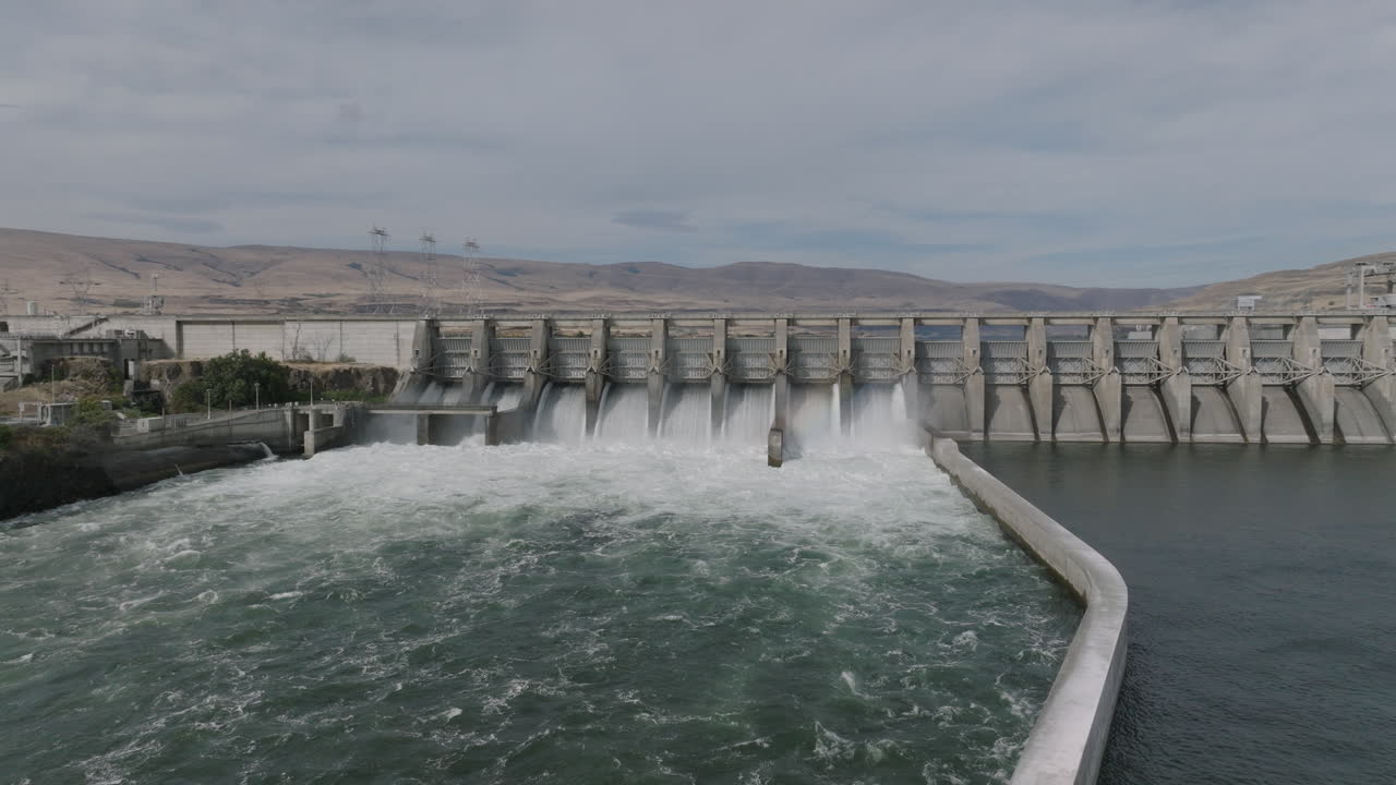 Drone aerial of a hydroelectric dam along the