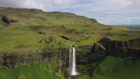 seljalandsfoss waterfalls in iceland with drone video moving out