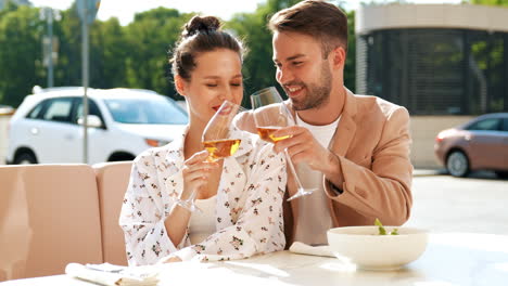 couple enjoying drinks at outdoor cafe