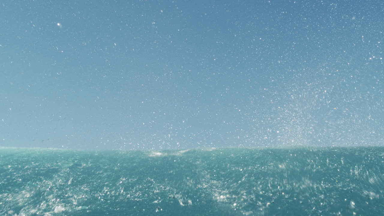 Sparkling tropical ocean water glistens in bright sunlight, dreamy and abstract