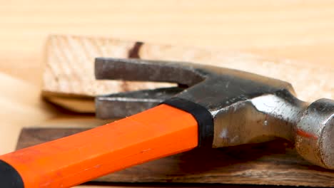 Slow side shot of hammer and pieces of wood