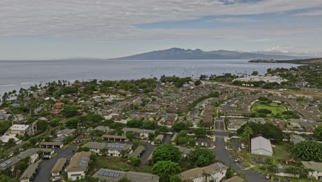 Lahaina-Maui-Hawaii-Aerial-v2-cinematic-drone-flyover-coastal-neighborhood-towards-historic-wharf-capturing-houses-and-Kahoma-stream-with-Molokaʻi-island-views---Shot-with-Mavic-3-Cine---December-2022