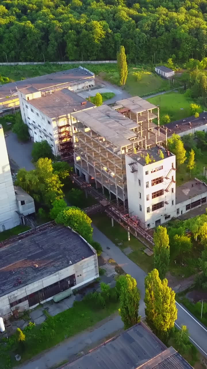 Factory With Broken Windows. Aerial view of an old factory ruin and broken windows Vertical video