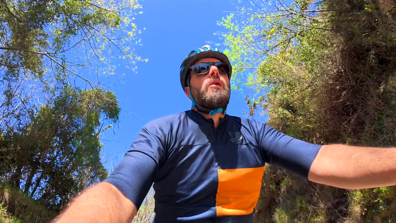 Man cycling outdoors in nature