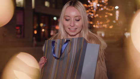 young woman given present and is extremely happy to receive it - in slow motion