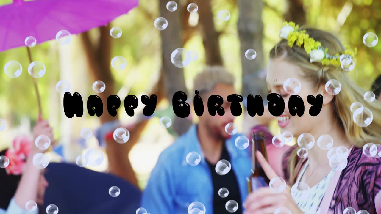 Celebrating birthday outdoors, people with bubbles and happy animation text