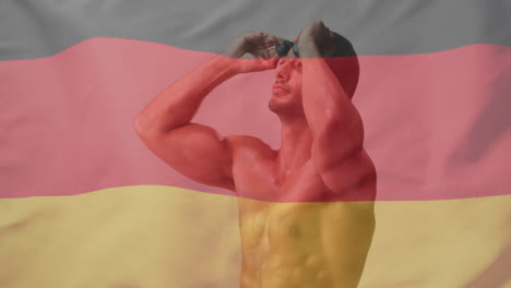 animation of flag of germany over caucasian male swimmer