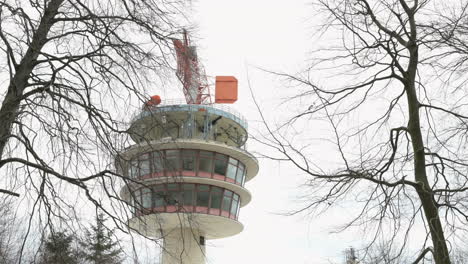 radar tower on the neunkirchnerhöhe, darmstadt, odenwald, germany during winter with trees in front