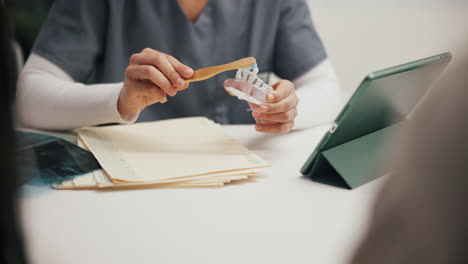 dental hygienist examining a patient's mouth guard