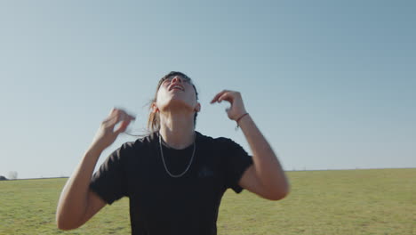 girl juggling soccer ball with head outdoors