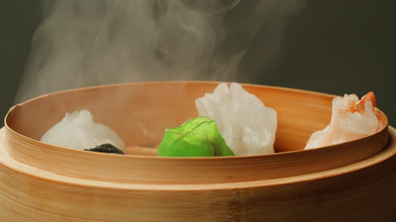 Hot Steaming Dim Sum Dumplings in a Traditional Bamboo Steamer