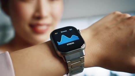 woman's smartwatch displaying stress levels
