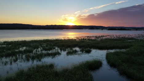 sunset over a marsh and lake