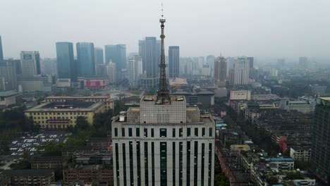 skyscraper high rise tower on building in downtown chengdu, china - aerial