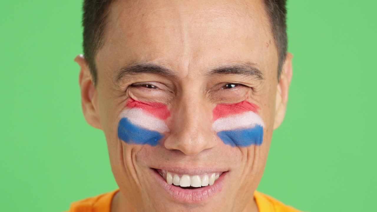 Close up of a man supporting dutch team