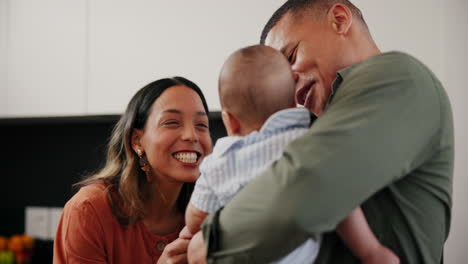 Baby,-laughing-and-a-couple-cooking-in-the-kitchen