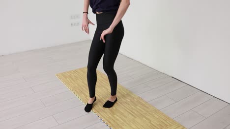 Woman in Leggings on Yoga Mat