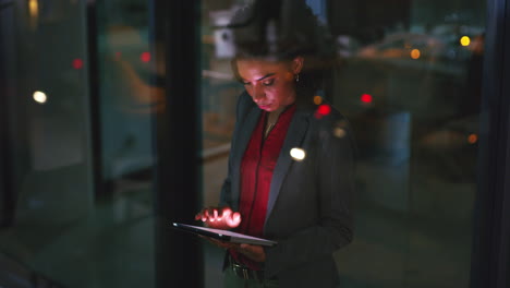 a young businesswoman working on a digital tablet