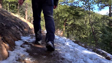 man walking in mountain trail in slow motion