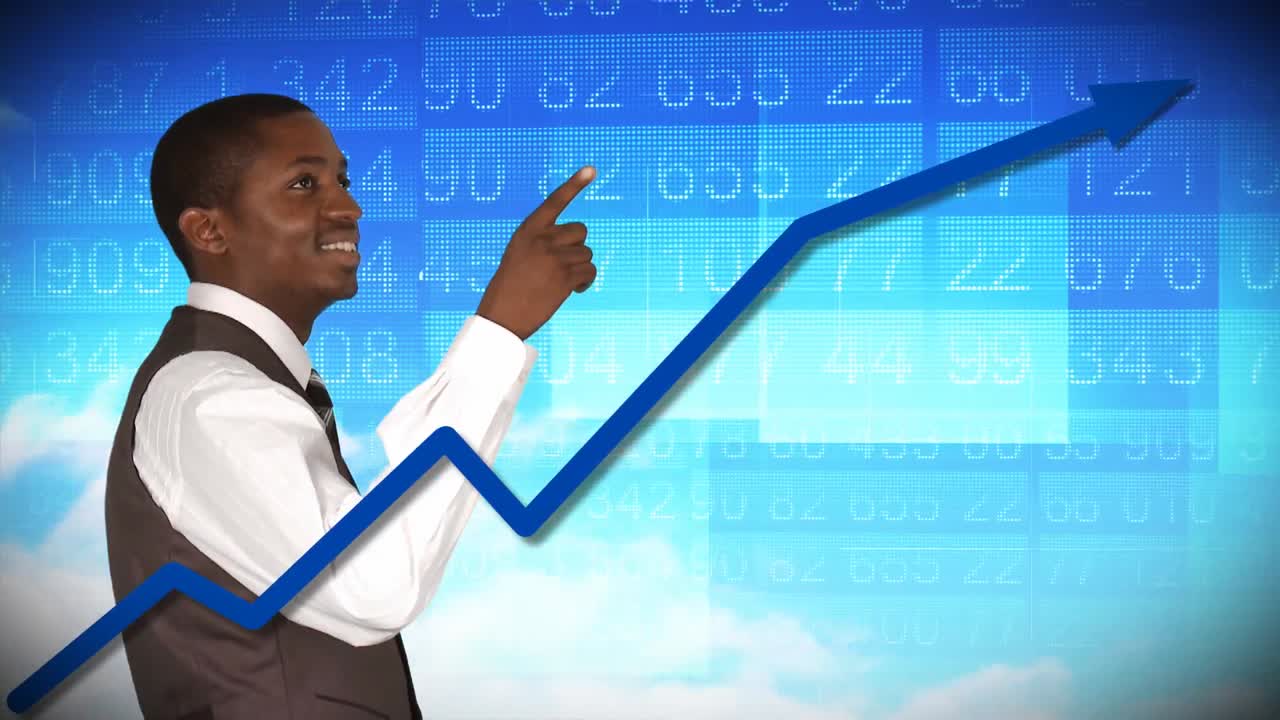 Smiling businessman looking at a stock market