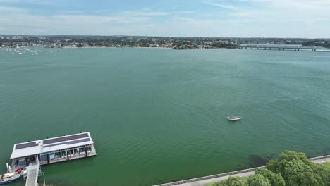 aerial pan around kogarah bay at sans souci taking in the captain cook bridge