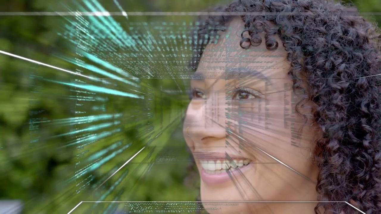 Woman smiling, teal code emerging left sweeping face, demonstrating tech for designers