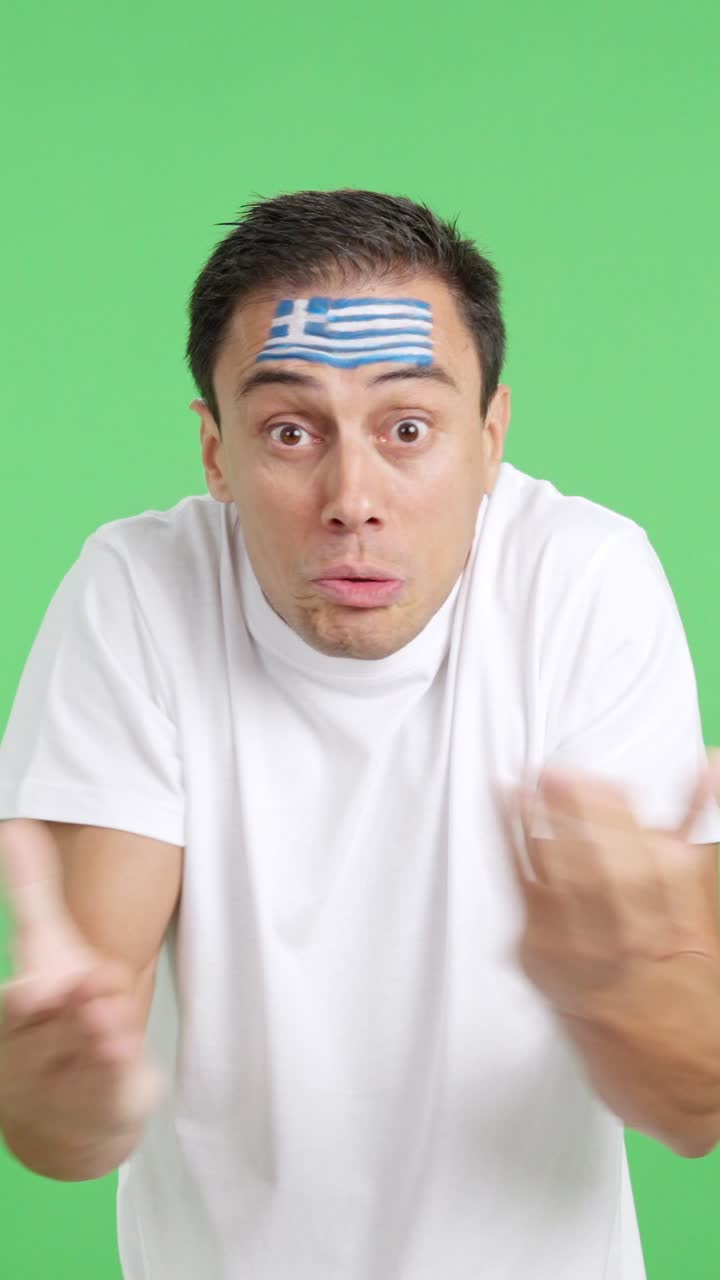 Man Cheering for Greece, angry with the decision of referee