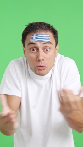 man cheering for greece, angry with the decision of referee