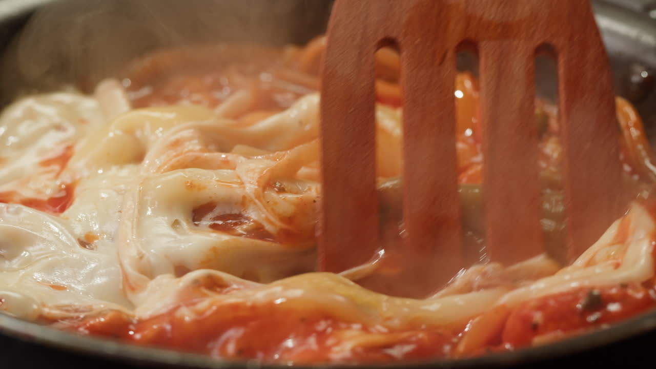 Cooking Spaghetti with Cheese and Tomato Sauce