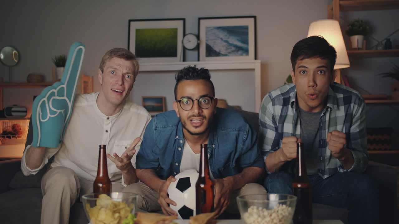 Friends Celebrating a Soccer Game at Home