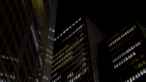 modern cityscape at night with illuminated office buildings in frankfurt, germany