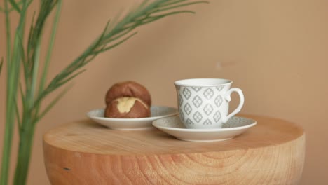 coffee and cookies on a wooden table