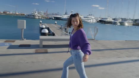 young woman enjoying a stroll by the harbor