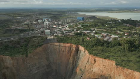 rotating aerial shows massive rock pit at cullinan diamond mine