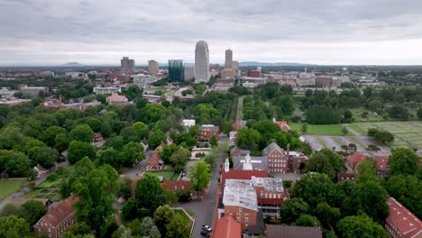 Aerial-high-push-into-Winston-Salem-NC,-North-Carolina-over-Old-Salem