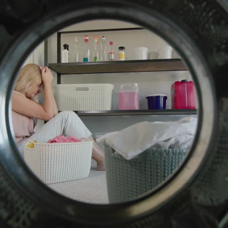 Tired-woman-sits-in-a-washroom