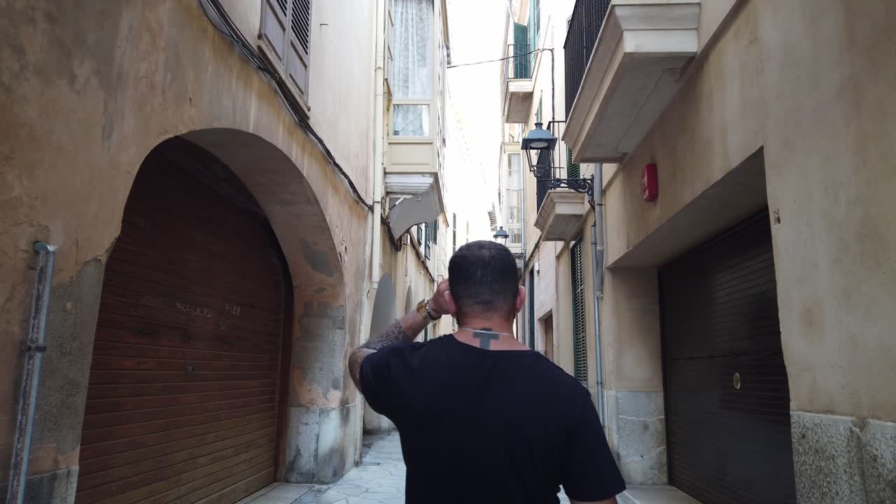 walking through the old town of palma de mallorca
