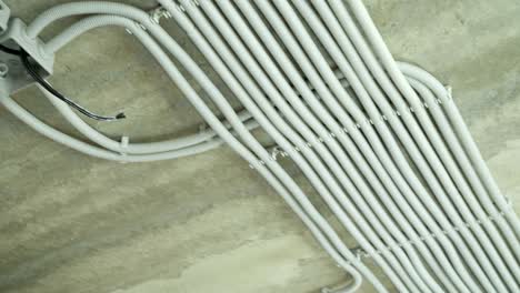 electrical installation of plastic electrification tubes on building site