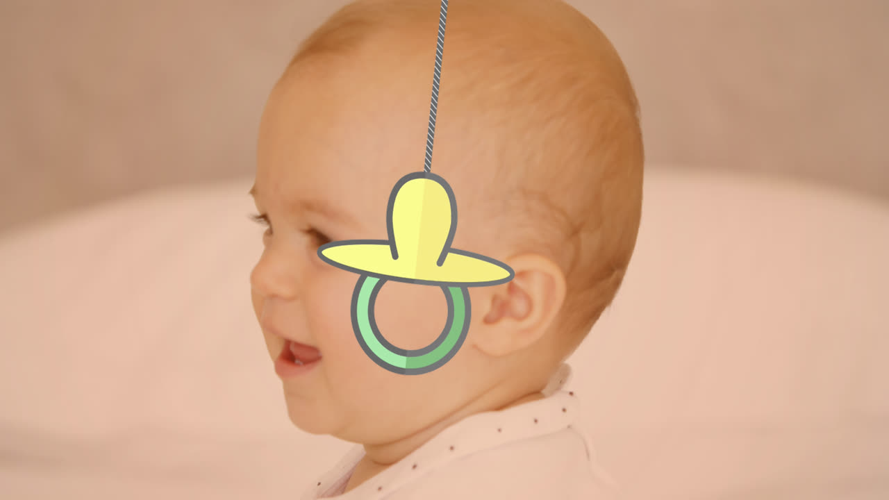 Animation of baby pacifier over happy caucasian happy baby