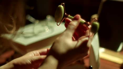 hand holding jade roller